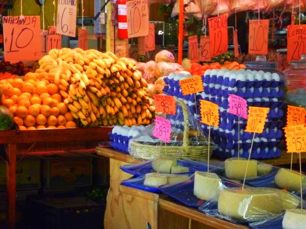 Cheese, bananas, oranges, and eggs for sale at one of the stalls in Los Globos open air market in Ensenada, Baja California Norte, Mexico.