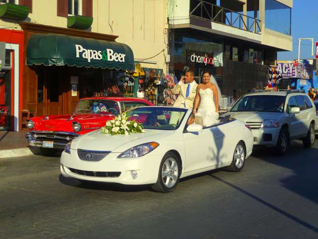 Wedding party cruising down Calle Primera in Ensenada, Baja California Norte, Mexico.